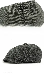 Detail des elastischen Verstellbandes an einer schwarzen Schiebermütze mit Fischgrätmuster