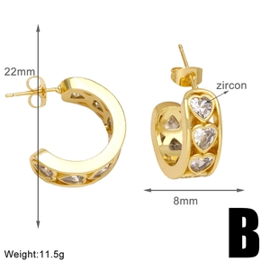 Detail view of gold C-shaped heart earrings with zircon inlay showing dimensions 22mm by 8mm