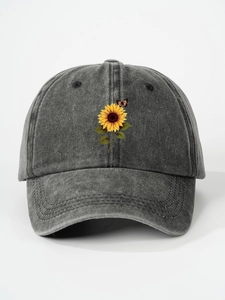 Detailed close-up of the vintage washed grey cotton cap with sunflower butterfly print