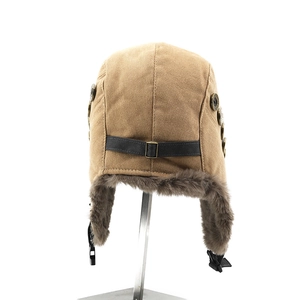 Detail of khaki aviator hat showing grey faux fur lining and vintage copper buttons