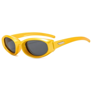Fashionable oval yellow sunglasses with thick frames and silver metal temple accents