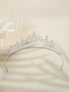 Detailed close-up of a silver vintage bridal crown with sparkling rhinestones and zircons