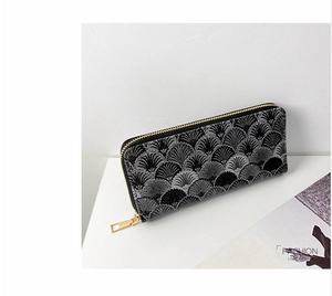Detail of long wallet with fan-shaped embroidery and golden zipper puller
