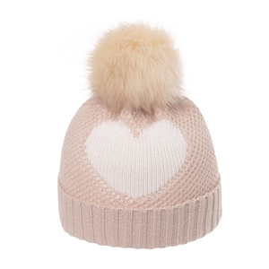 Pink knit hat for children featuring a white heart pattern and a soft yellow faux fur pompom