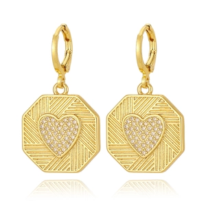 Macro detail of 18K gold plated earring with octagonal frame and heart-shaped micro-inlay