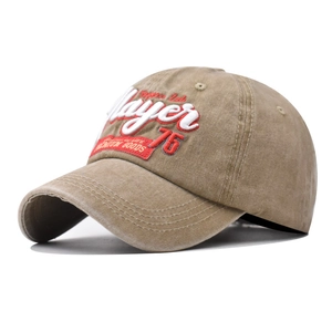 Detail of khaki washed cotton baseball cap featuring premium Player 3D embroidery texture