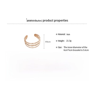 Detailed view of triple-layer gold iron cuff bracelet with realistic bamboo texture
