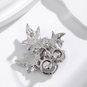 Back view of Christmas red cherry brooch with metal safety pin and large crystal detail