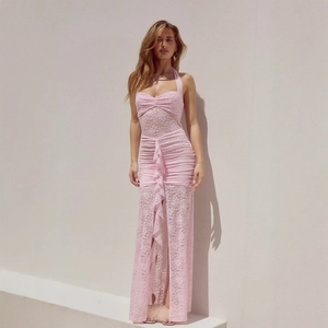 Detail of light pink lace halter dress showing sheer fabric and side ruffles