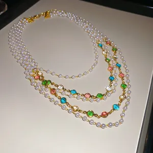 Elegant multilayer pearl and colorful gemstone necklace with gold chain and crystals