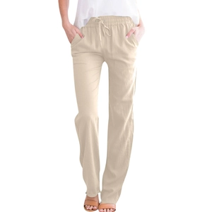 Detail of khaki linen trousers with elastic drawstring waist and side pockets