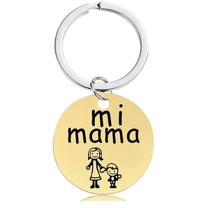 Detail of gold round pendant with mi mama engraving and silver stainless steel keyring