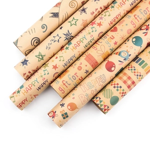 Assorted kraft paper gift wrap rolls featuring musical notes and festive patterns