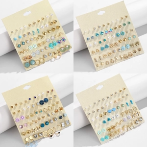 30-pair multi-style earring set featuring heart, star, and flower motifs in gold and silver