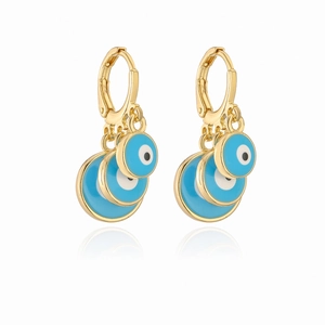 Detailed view of gold-plated evil eye hoop earrings with triple layered blue enamel charms