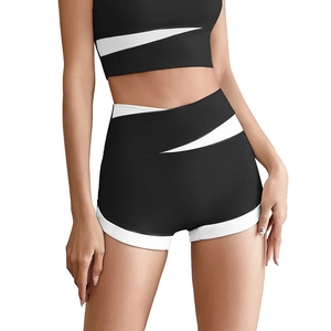 Women's black and white patchwork high-waisted yoga set with sports bra and shorts