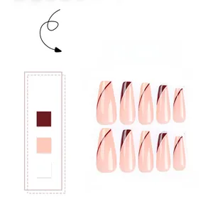 Macro detail of long coffin false nails in nude pink with burgundy diagonal art