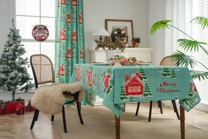 Detailed Christmas table runner with festive house and pine tree patterns on high-quality fabric