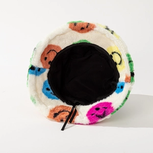 White fuzzy knit bucket hat with colorful smiley patterns and adjustable black drawstring