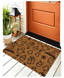 Detailed view of brown Christmas doormat with Merry Christmas pattern at an orange door