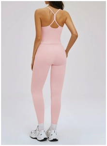 Pink yoga set featuring a strapless racerback top and high waisted leggings from the back