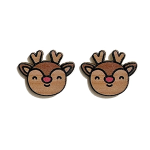 Close-up of cute wooden reindeer stud earrings with brown finish and pink nose details