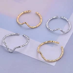 Minimalist wave textured open rings in gold and silver finish with hammered metal surface