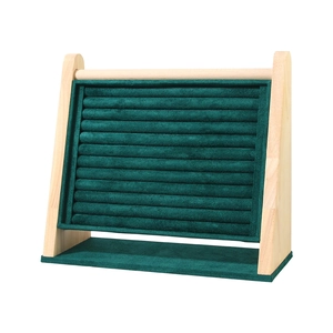 Slanted wooden jewelry display stand with green velvet slots for rings and bracelets