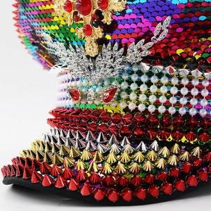 Rainbow sequin party captain hat with red rivets, gold cross, and metallic wings