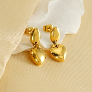 Elegant 18K gold plated heart drop earrings on stylish minimalist stone background