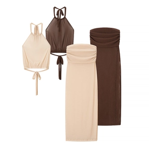 Chic two-piece knit set featuring a halter crop top and long bodycon skirt in beige and brown