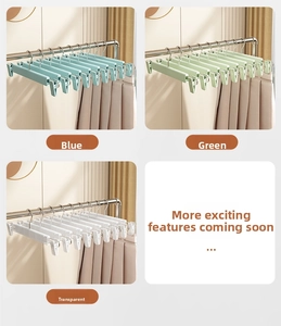 Close-up of adjustable 10-clip clothes hanger in blue green and transparent colors