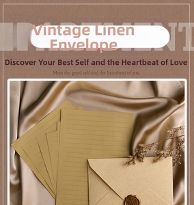 Linen texture envelope with gold wax seal and ruled stationery on silk fabric background