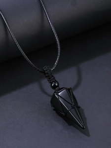 Macro detail of obsidian hexagonal pendant with handcrafted woven black rope design