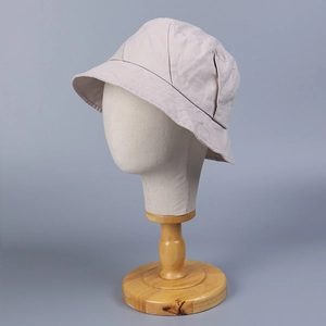 Detail view of stitching and texture on light beige washed cotton fisherman hat