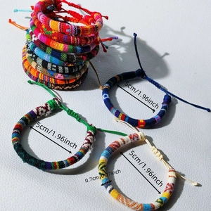 Detail showing colorful woven surf bracelets with adjustable size dimensions and measurements