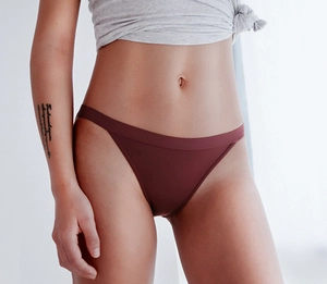 Low waist ice silk panties in reddish-brown shown on model for a smooth fit