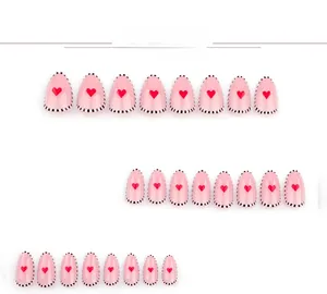 Détails de 24 faux ongles amande roses avec cœur rouge et bord à pois noirs et blancs