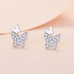Sparkling butterfly stud earrings with white zircon accents in elegant silver finish