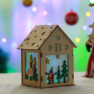 DIY glowing wooden Santa house Christmas ornament with laser-cut festive details
