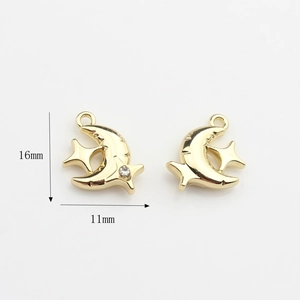 Detail view of 16mm x 11mm gold crescent moon and star charms with crystal rhinestone
