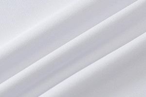 Detailed macro shot of premium white textile fabric with fine horizontal texture
