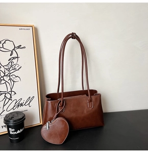 Retro brown glossy faux leather shoulder bag with a heart charm and coffee accessories