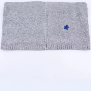 Gray knitted neck warmer with blue flower embroidery and front metal zipper closure