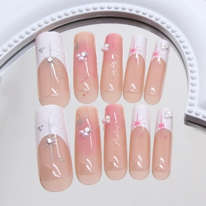 Sparkly French blush press-on nails with pearls, star accents and rhinestones