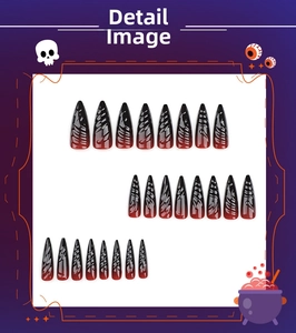 Detailed view of 24 black and red gradient stiletto press-on nails with punk scratch texture