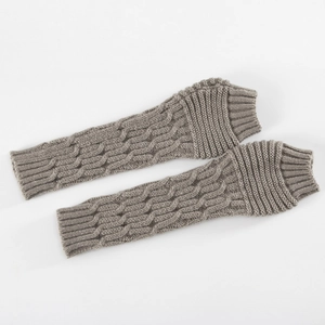 Detailed close-up of brown knitted arm warmers showing thick ribbed texture and elasticity