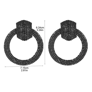 Detail shot of large black hoop earrings with rhinestones showing dimensions in inches