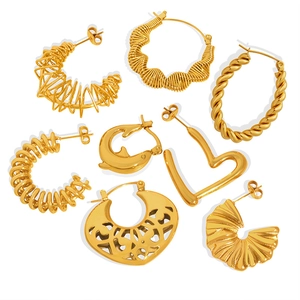 Retro hollow asymmetrical gold earrings set featuring diverse metal spiral designs