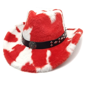 Detail of red cow print plush cowboy hat with leather band and metal sun emblem